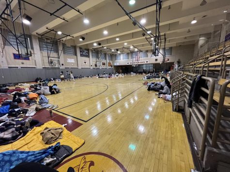 Students were camped in the gymnasium all night. Here they are attempting to continue reading without falling asleep after eleven hours at the Read-a-thon