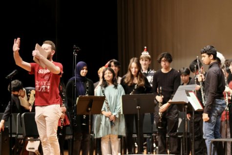 Concert band bowing after their performance.