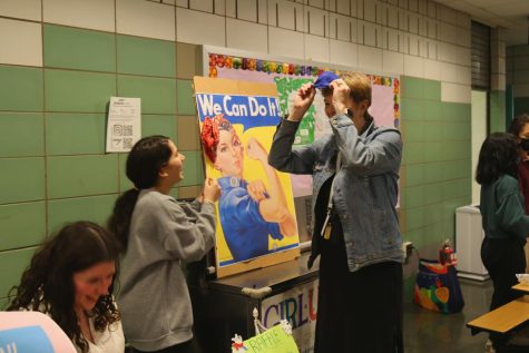 Students represented their clubs at the Winter Carnival by hosting activities and selling food. Pictured is Ms. Fee participating in Girl Up’s booth. 
