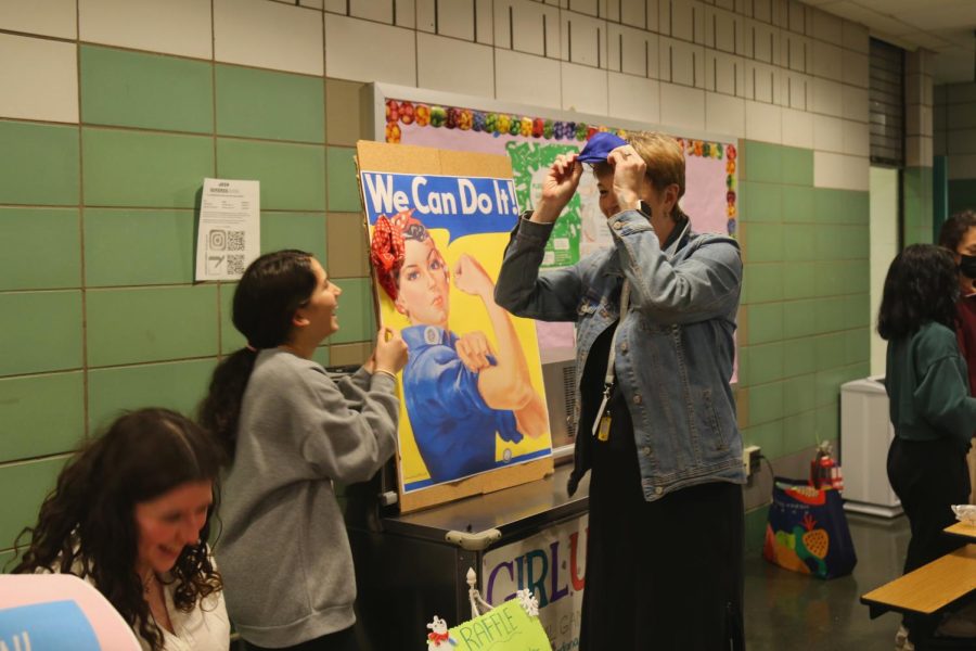 Students represented their clubs at the Winter Carnival by hosting activities and selling food. Pictured is Ms. Fee participating in Girl Up’s booth. 