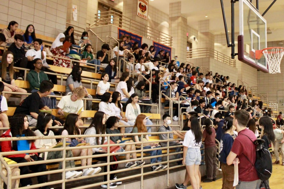 Students+from+the+Class+of+2027+congregate+in+the+gymnasium+at+the+start+of+orientation.
