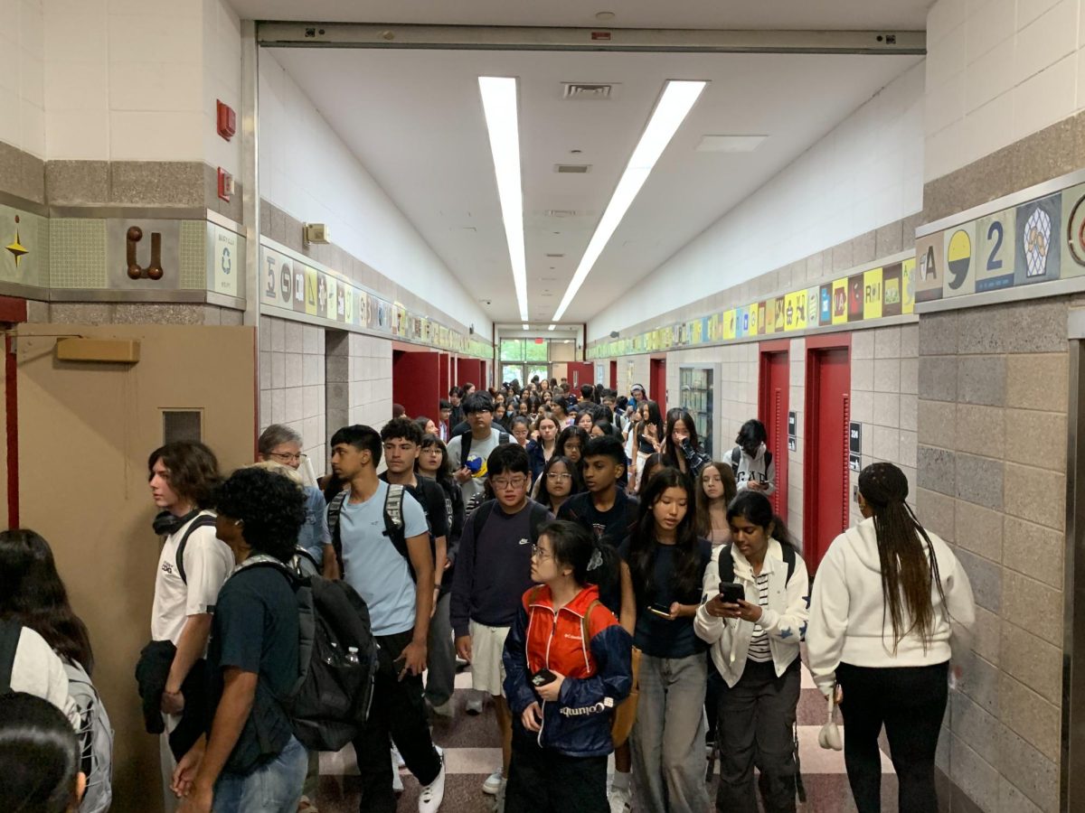 Students beginning their school day, and  walking to their first band class.