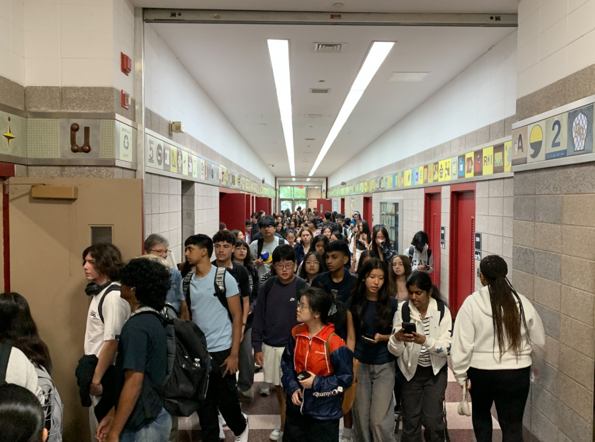 Students beginning their school day, and walking to their first band class.