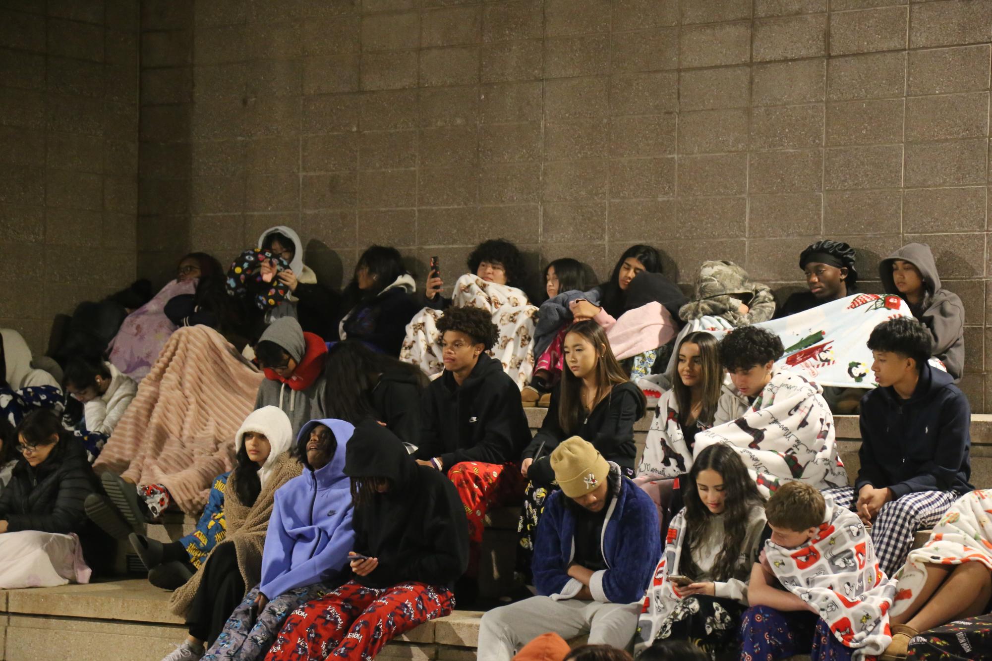 Students gathered in the courtyard to hear excerpts from horror stories by Stephen King as the sun rose.