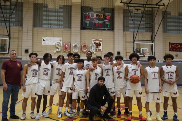 The Varsity Boys Basketball team winning against Academy of American Studies with a final score of 70-40 