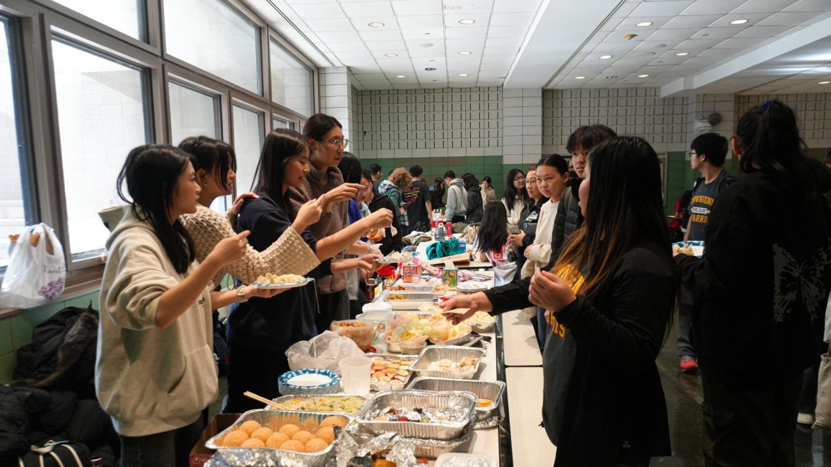 Students attending Asian Fest and eating traditional Asian dishes