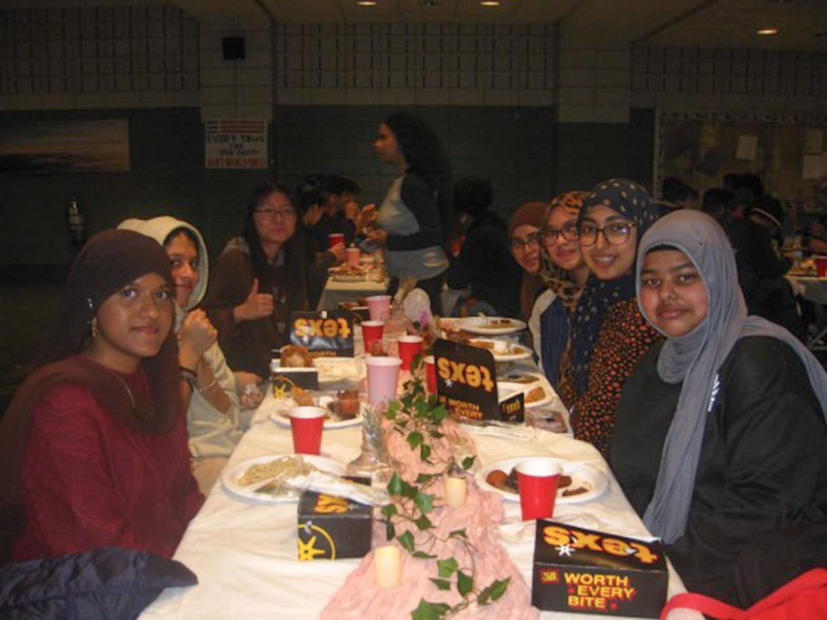 Students gathering and eating during MSA's Iftar event to celebrate Ramadan