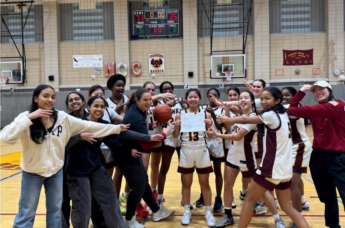 Girls Basketball team celebrating Rica's new record. 