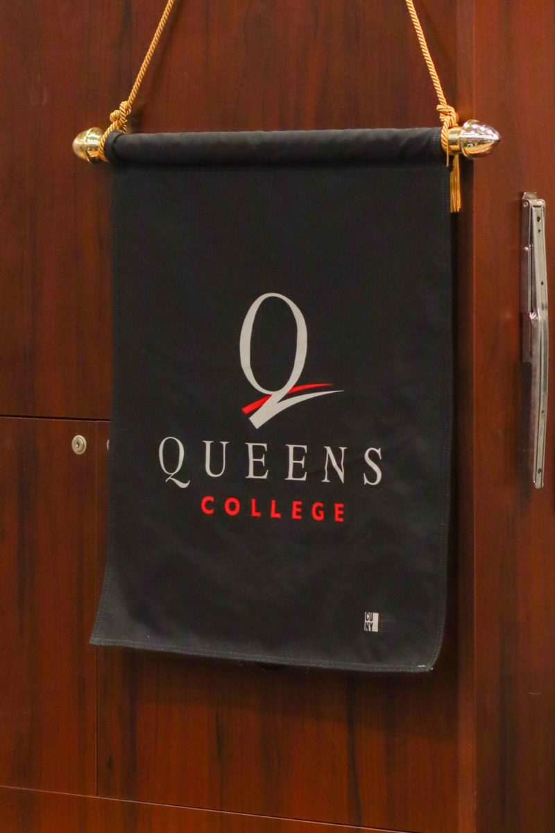 Queens College banner hung at the 2025 Humanities Symposium