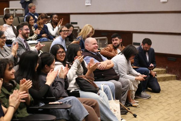 Students and Principal Brian Condon clapping during the awards ceremony