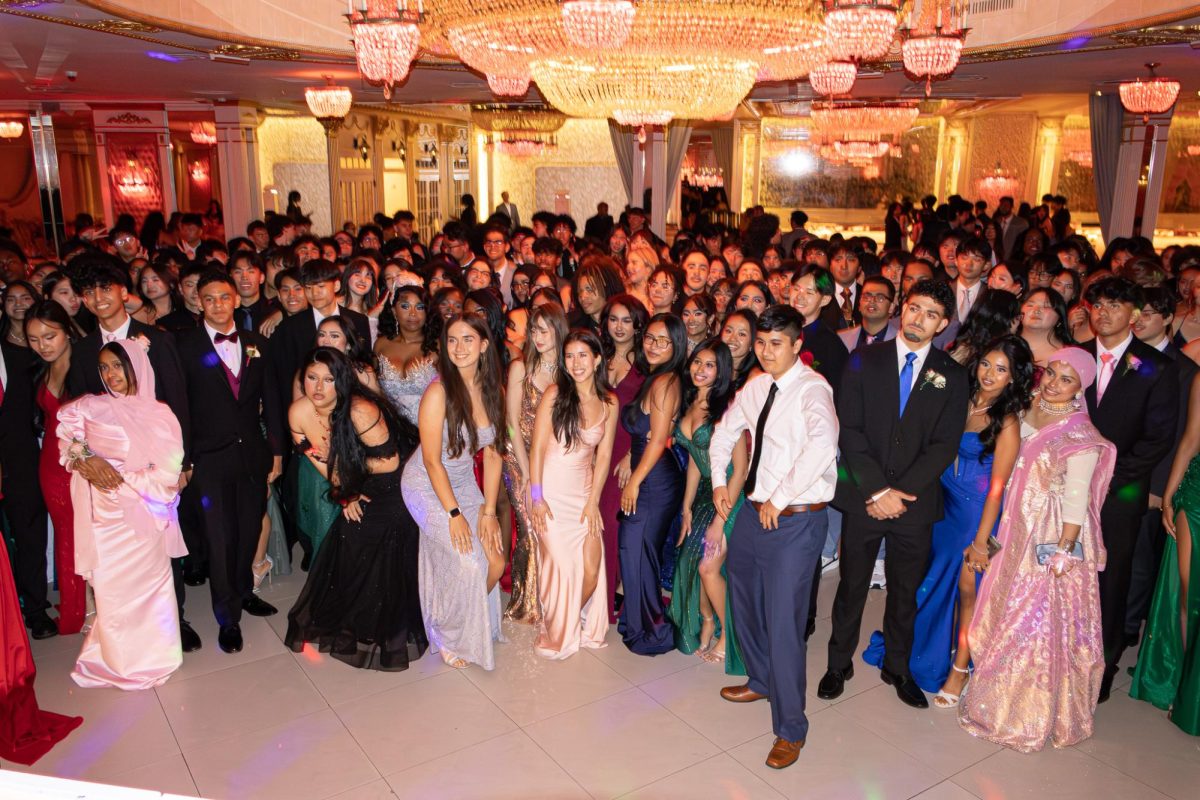 Students collecting for a group photo at the start of prom night