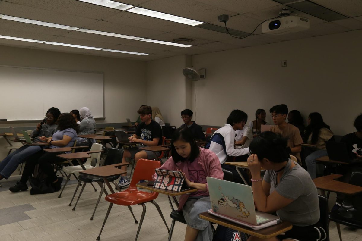 Students using devices in class. 