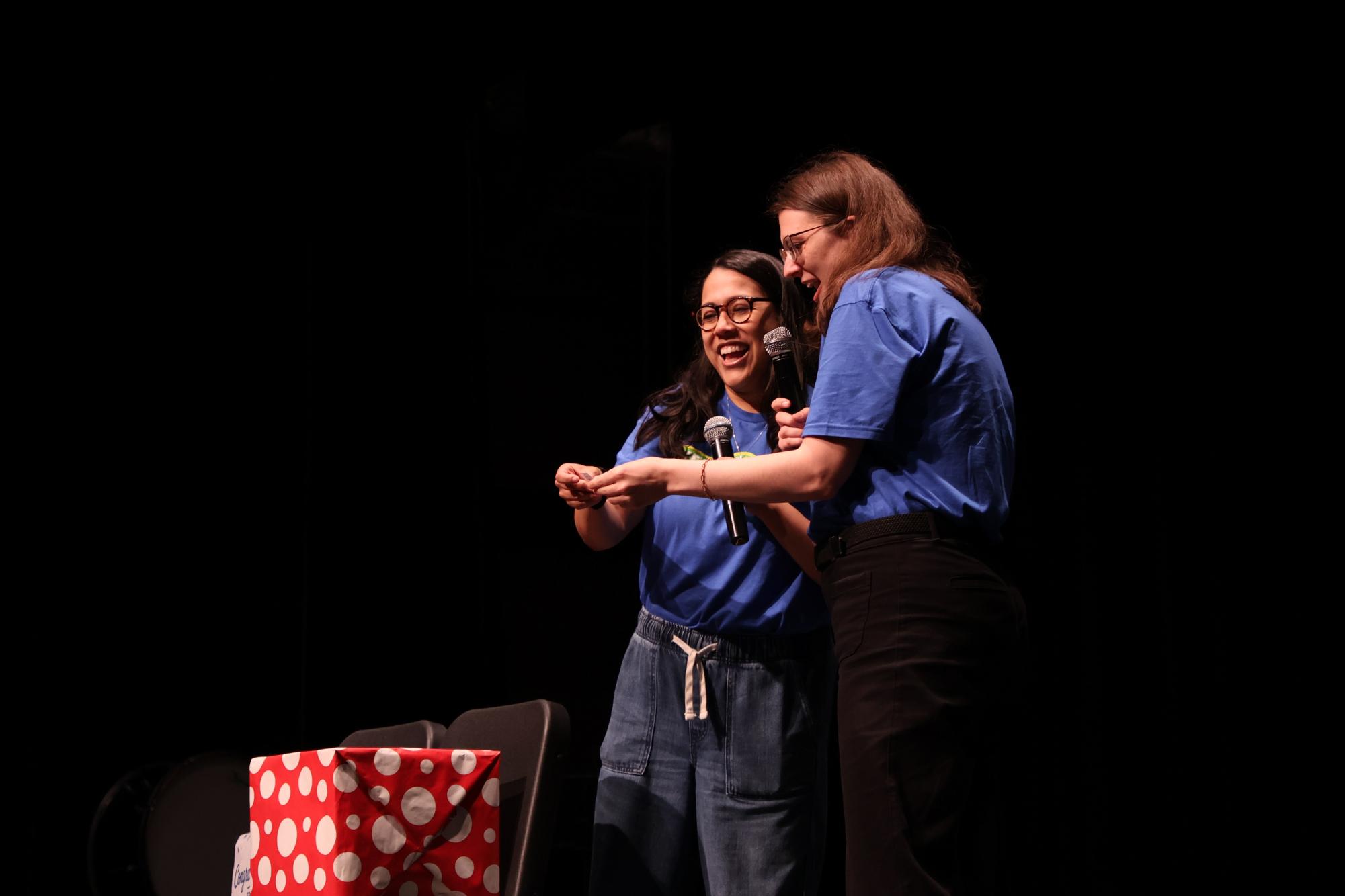 ISS teacher Natali Frank and English teacher Katherine Lipinski announcing prize winners during Keepers Day