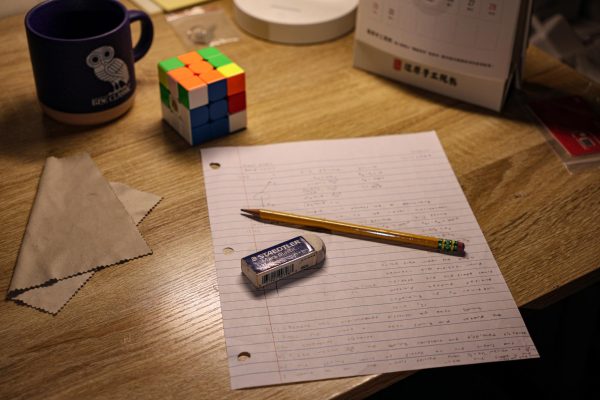 A pencil and paper indicating the possible increase of handwritten assignments.