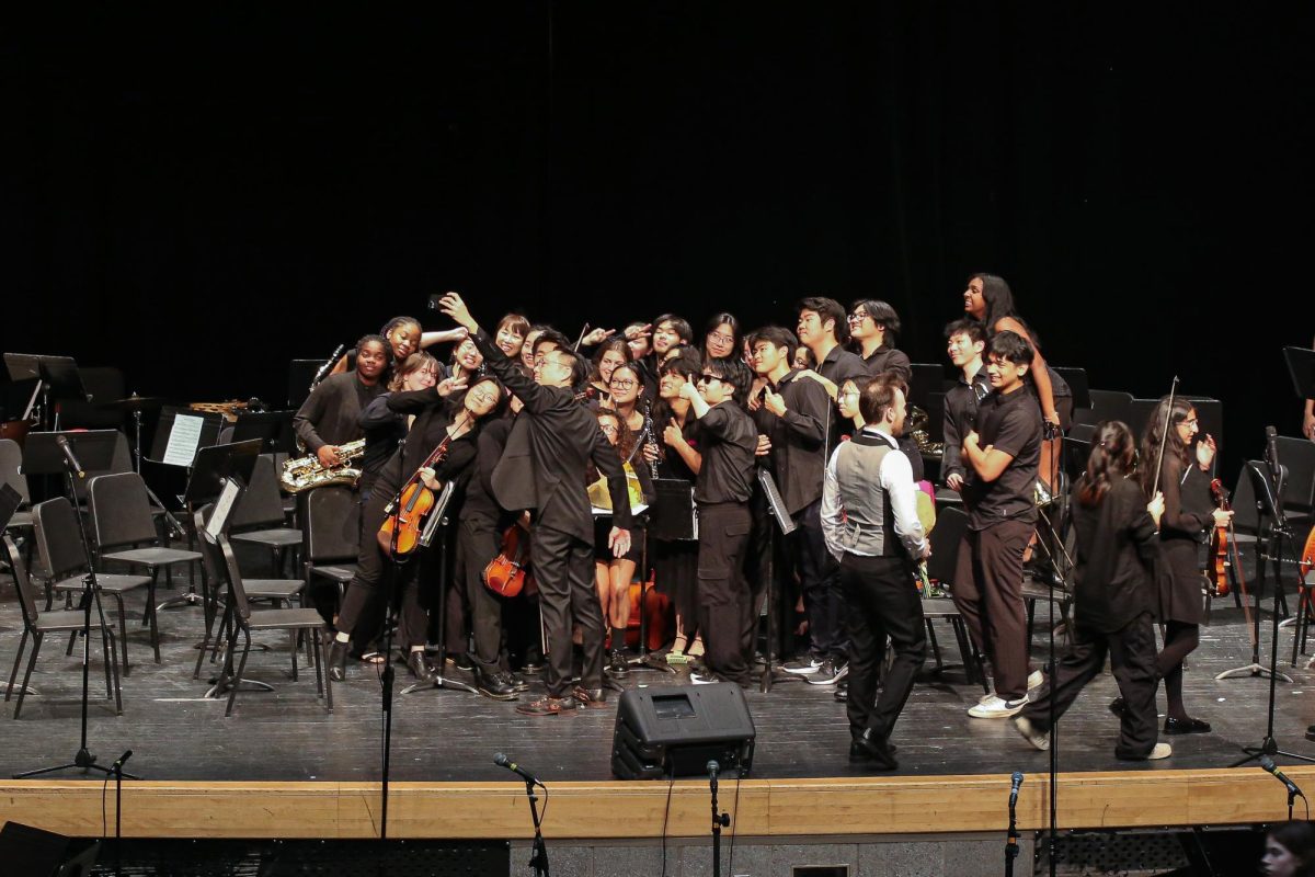 Mr. Lee and students take a selfie after their performance.