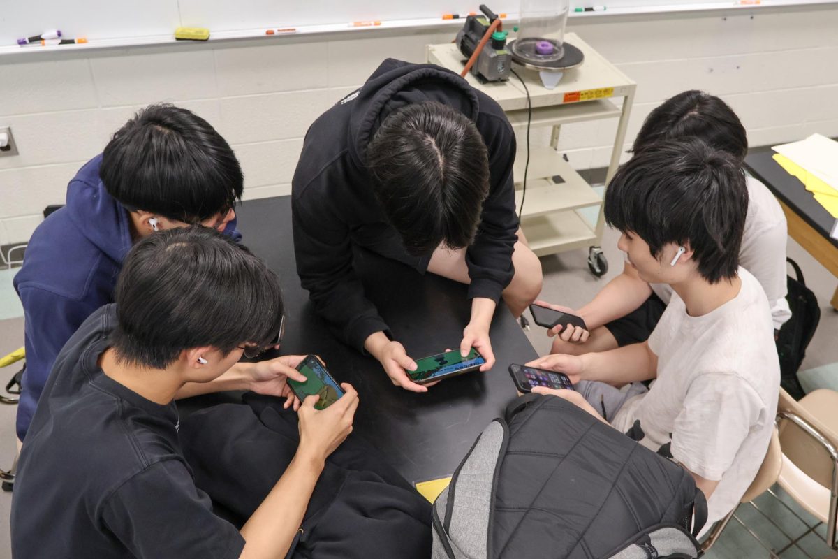 Students using cellphones in a classroom