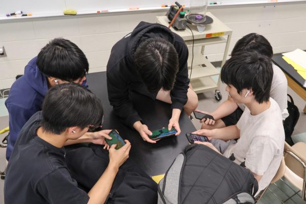 Students using cellphones in a classroom