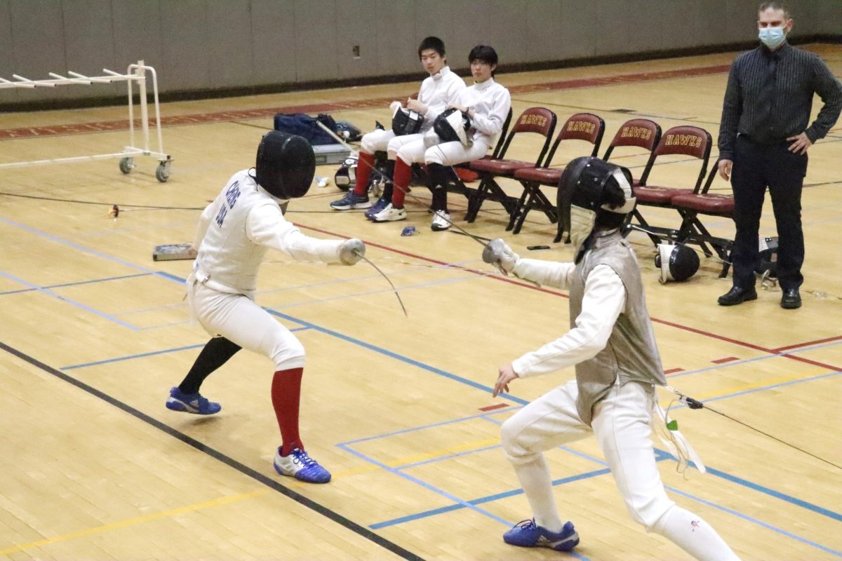 Two students facing off in the Townsend Harris vs Francis Lewis fencing match on October 6