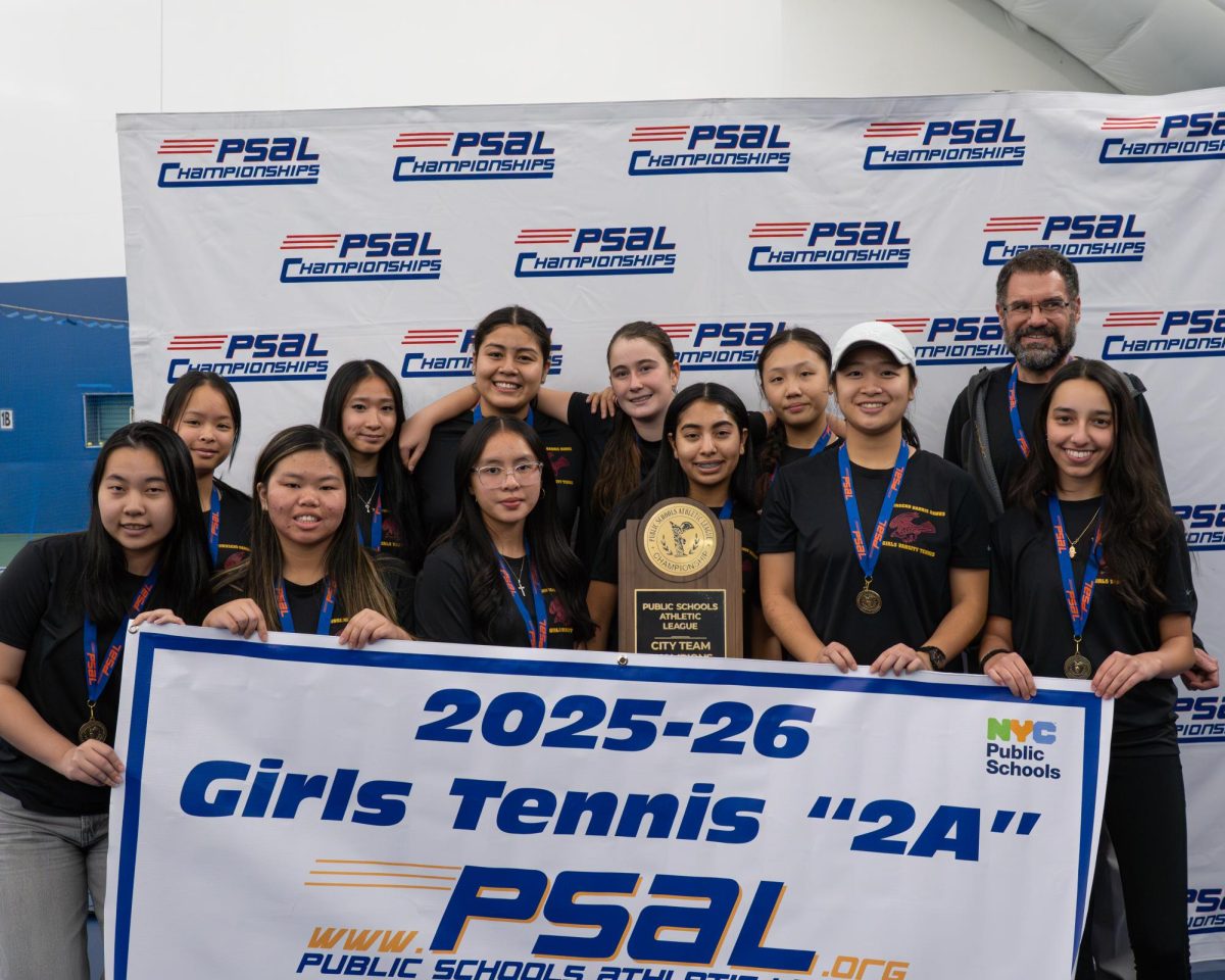 The girls varsity tennis team celebrates their victory as 2025-2026 PSAL city champions of the 2A division. The team went undefeated throughout the season and won their final match on November 10 against James Madison High School.
