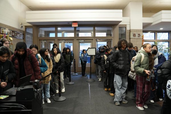 Students forming two lines for morning entry on Friday, the first day of ID scanning. 