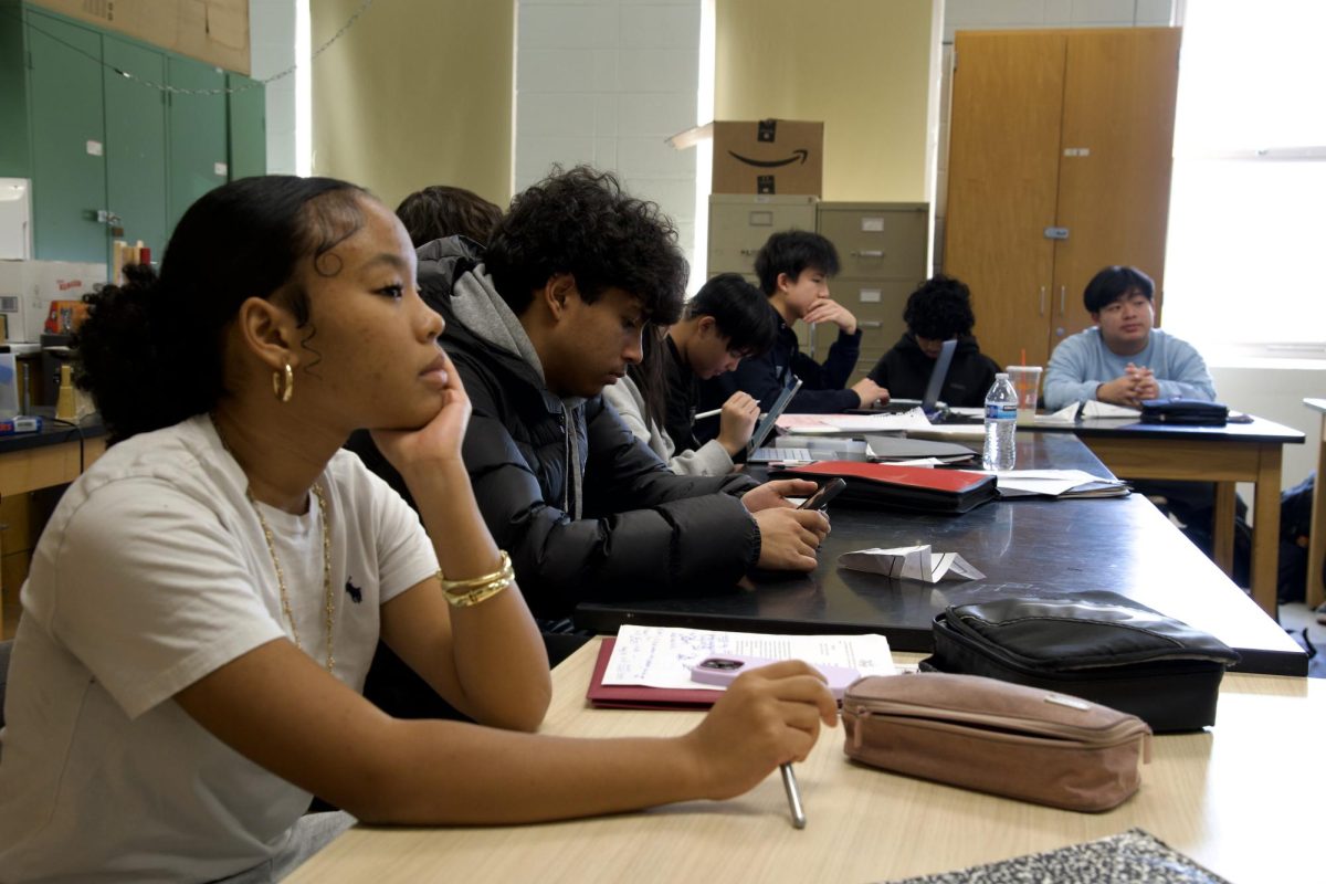 Students within physics teacher Joshua Raghunath's bands 5 and 6 physics hybrid class