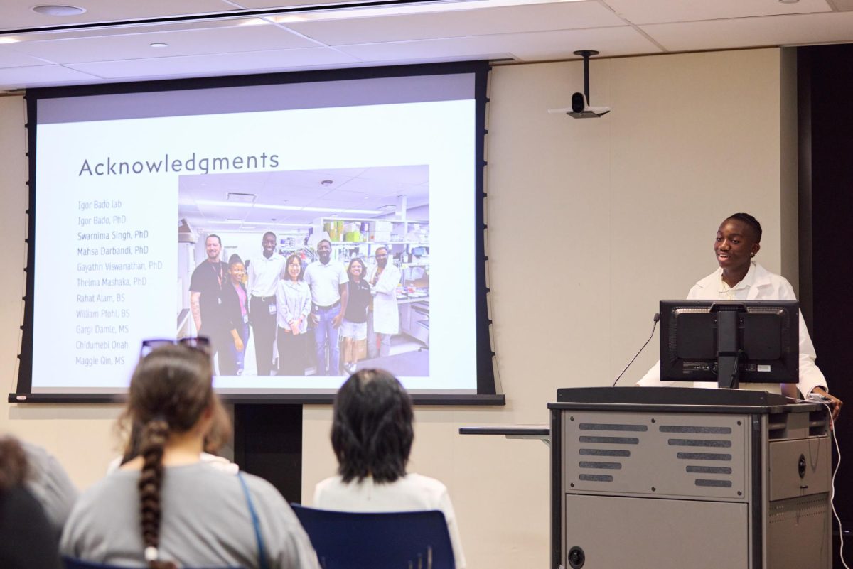 Senior Daniel Dixon presents the acknowledgments portion of his slideshow.