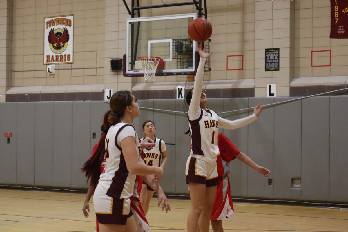 Sophomore Ava Yan reaches for the ball during the Hawks' home game against Flushing Campus High School last Thursday. 