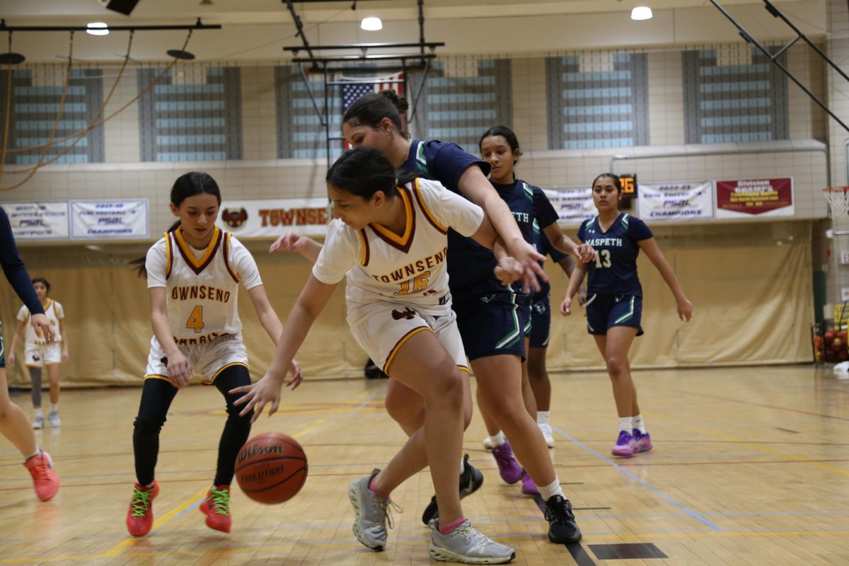 Freshman Raynaa Gosala is guarded by a player from Maspeth High School so she passes the basketball to sophomore Hayley Mitrani during the girls junior varsity basketball game on January 23. When asked about her thoughts coming out of the game, Raynaa said, “The game was really fun. I found it enjoyable. It was a lot of running and hustle, but overall it was really good.”
