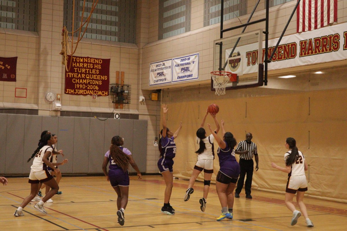 The girls varsity basketball team's game against Hillcrest High School on December 9. Both the girls and boys varsity basketball teams have advanced to the citywide playoffs. Senior Christian Corcuera, senior captain Edward Johnson, junior captain Sophia Madrazo, and sophomore Ava Yan have cumulated individual achievements.