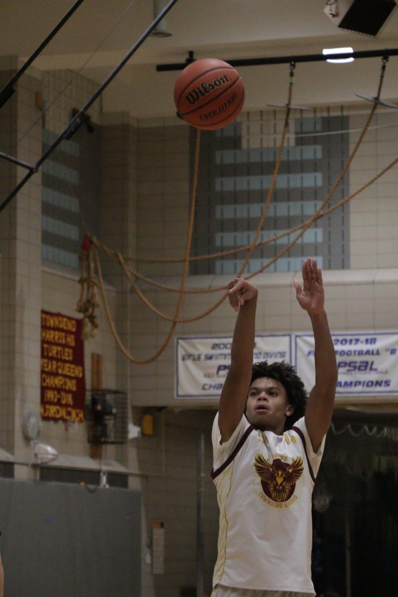 Senior captain Edward Johnson shoots the ball during a match against Benjamin N. Cardozo High School on December 3