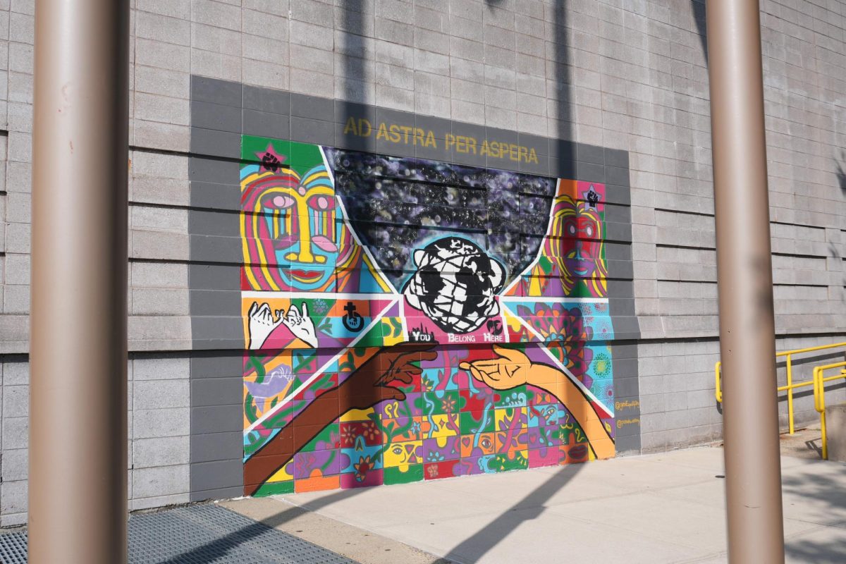 A vibrant and colorful mural on the THHS building illustrating themes of connection and inclusion