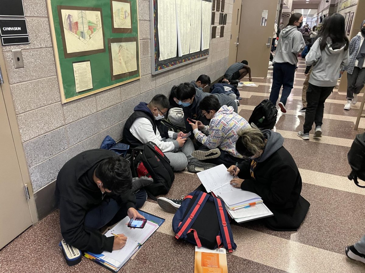 Students work in the halls wearing masks during the first year back in person following national school closures in March 2020. 