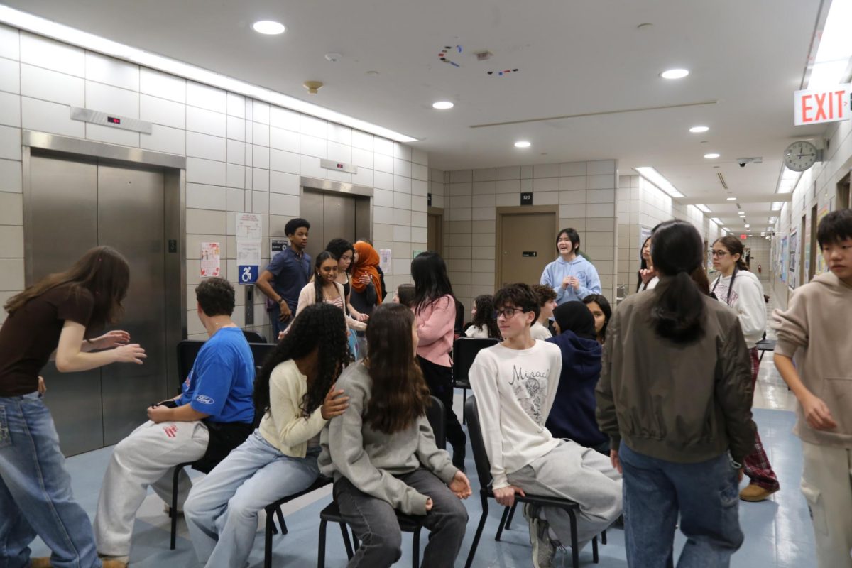 Freshman participating in one of the 9 stations, musical chairs, in the Freshman Scavenger Hunt. Although teams competed for a prize, the scavenger hunt's ultimate goal was to provide freshmen with an opportunity to explore the school and bond with one another.