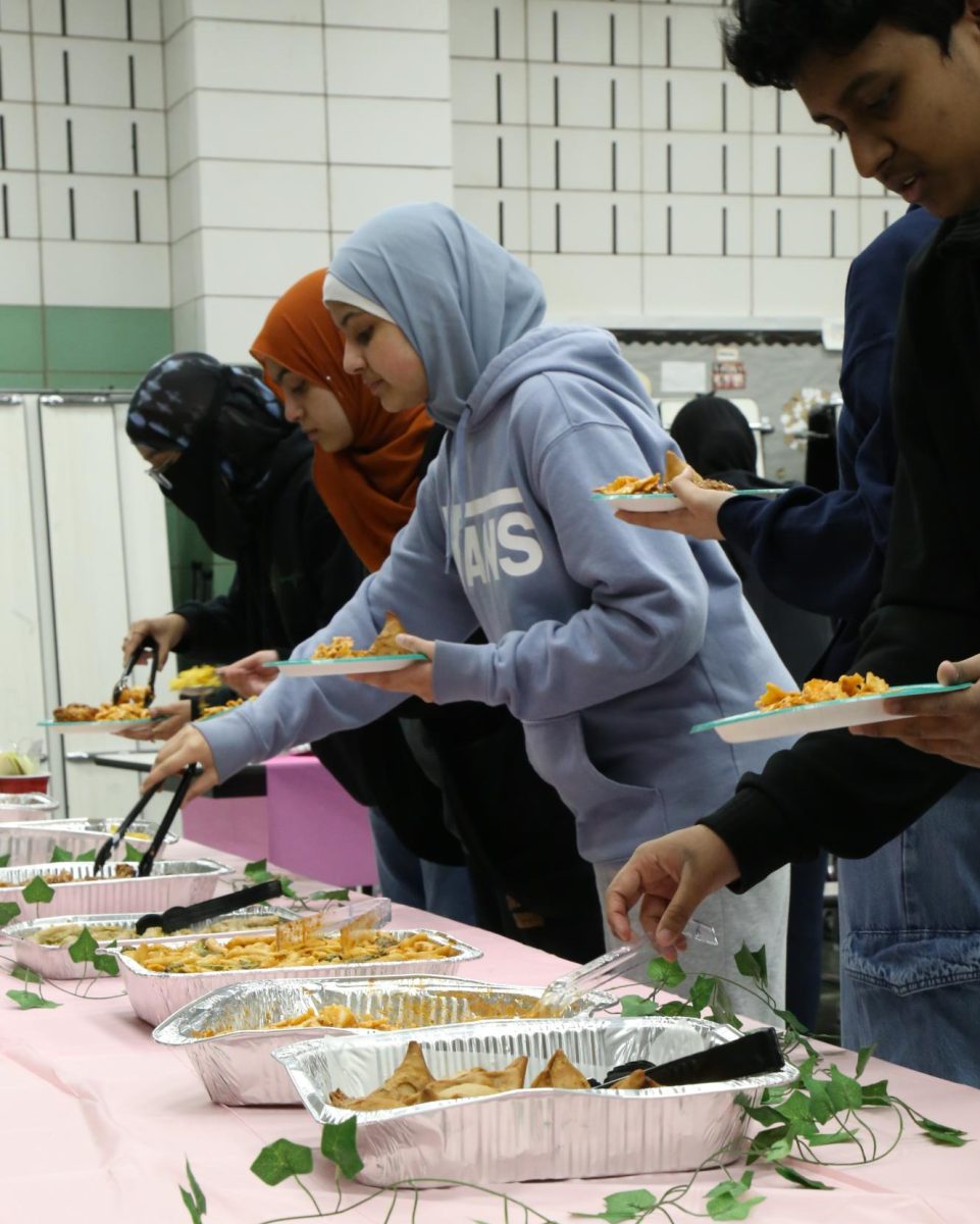 Students gathering and eating during MSA's Iftar event to celebrate Ramadan on March 5.