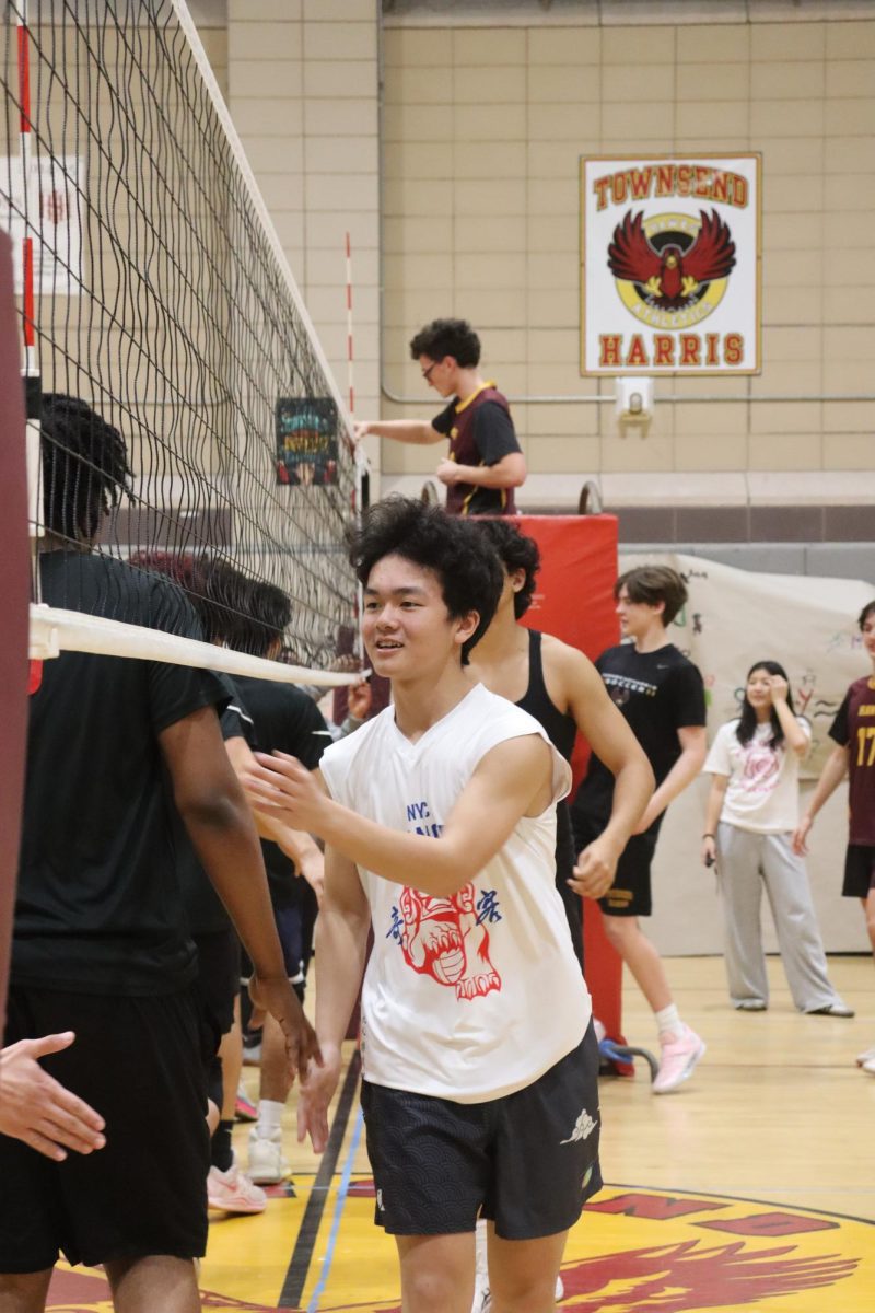 The THHS boys varsity volleyball team greeting the Far Rockaway Educational Campus team at the start of their scrimmage on March 16. Senior captain Brian Merino said, “I think the biggest takeaway from the Far Rockaway scrimmage was that we need to focus on staying in the game. Although we are good players, and have great chemistry, we have to stay focused throughout the whole game.”
