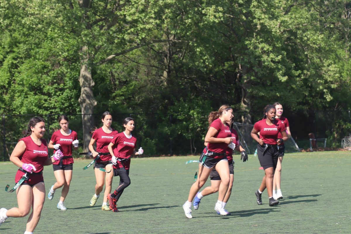 The 2024-2025 girls varsity flag football team running during a match against Far Rockaway Educational Campus on May 8, 2025, securing a 20-0 win.