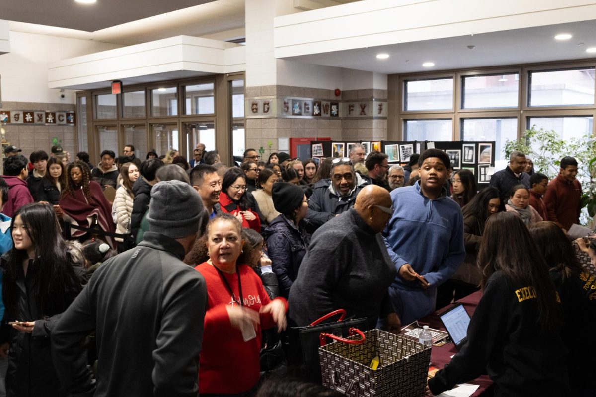 Accepted students and their families enter THHS to tour the school. All guests entered and were checked in at tables in the lobby before proceeding to a presentation in the auditorium.