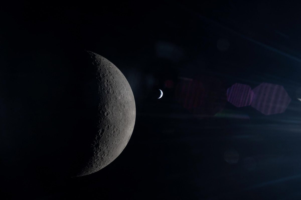 Seen from behind the Moon during Artemis II, the Moon and Earth align in the same frame, each partially illuminated by the Sun, photographed by the NASA Artemis II crew from the Orion spacecraft during the lunar flyby mission, April 6, 2026. NASA/Handout via REUTERS