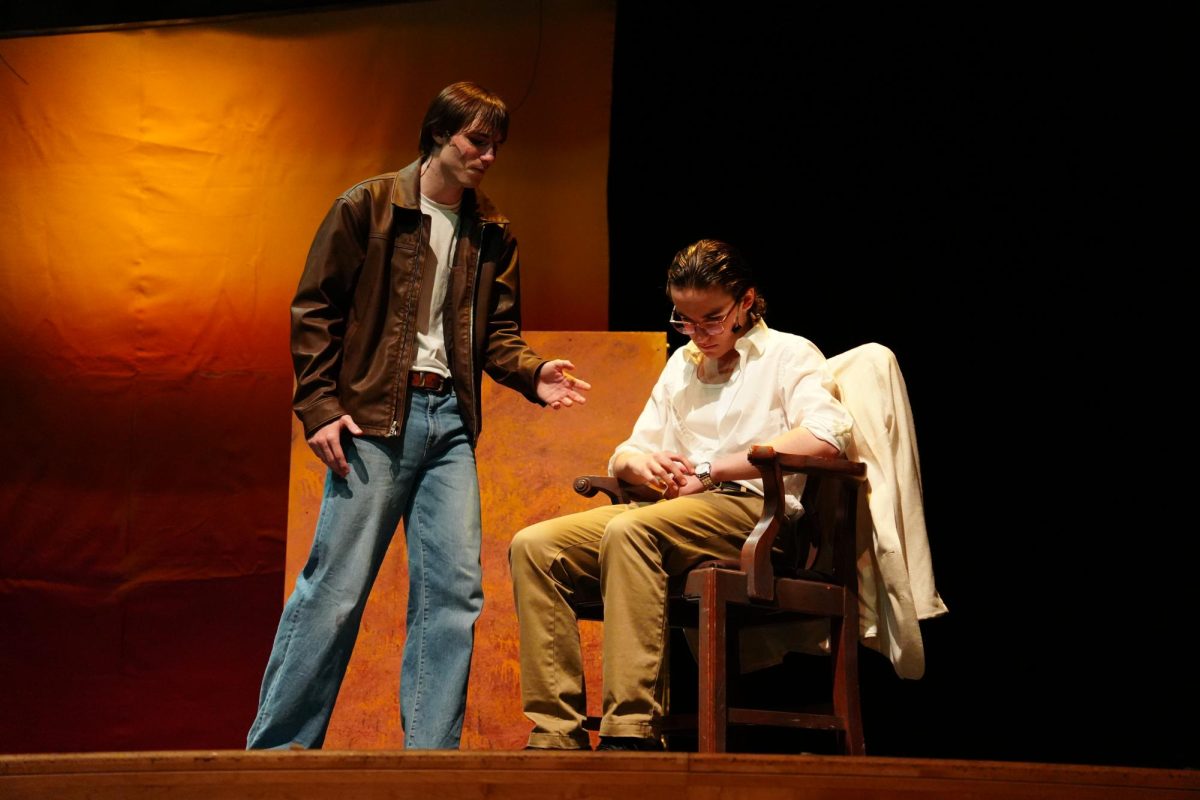Ren McCormack, played by junior Lukas Cooper, confronting Reverend Shaw Moore, played by sophomore Benjamin Wilkinson, after the town council refused to lift the ban on dancing. 
