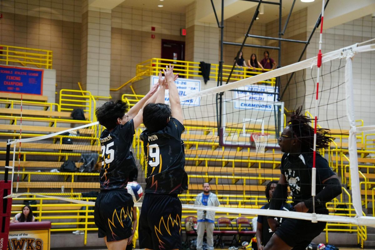 Freshman Tenzin Lodhen and Junior Neo Mun blocking the ball during a game against Epic High School North on April 14. 