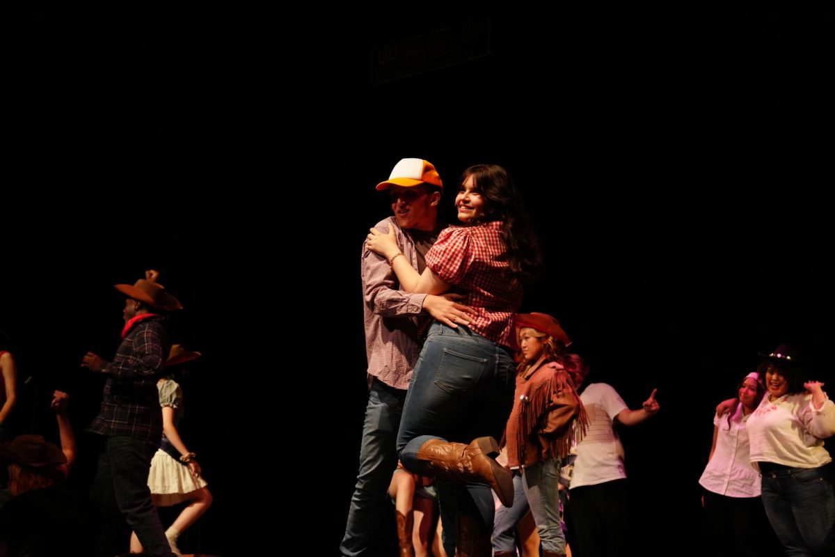 Willard Hewitt, played by senior Bryson De Los Santos, dancing with Rusty, played by sophomore Lilly Chase, to the song “Let’s Hear it for the Boy” during the April 18 Nightingale “Footloose” performance.
