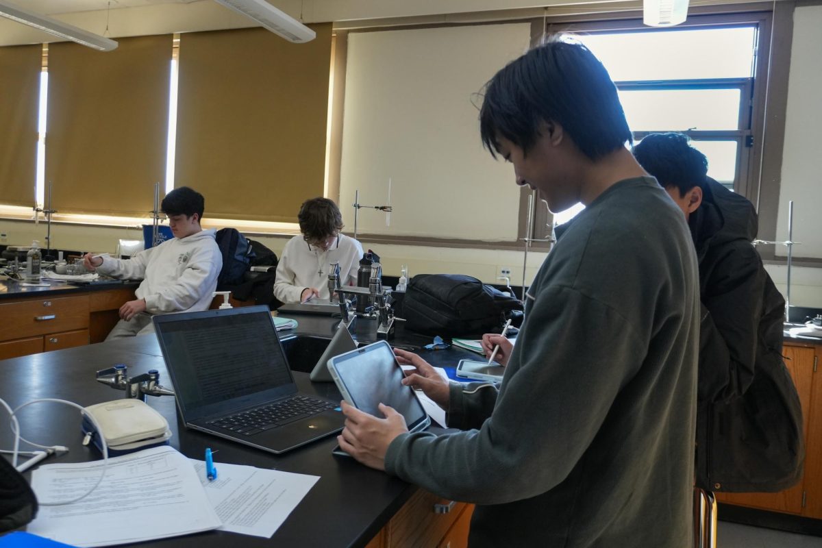 Students in AP Chemistry use one of the iPads Mr. Heitman acquired for class through DonorsChoose.org