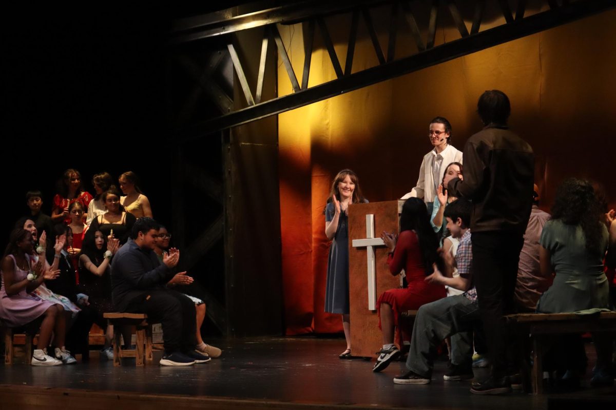 Reverend Shaw Moore, played by sophomore Benjamin Wilkinson, allowing Ren McCormack, played by junior Lukas Cooper, to throw a dance after dancing was banned in the town of Bomont. 
