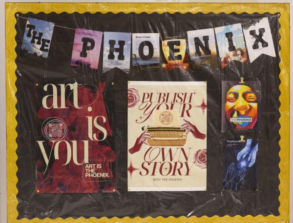 The Phoenix's bulletin board featuring their past publications. The Phoenix offers students opportunities to explore art, photography, and writing.