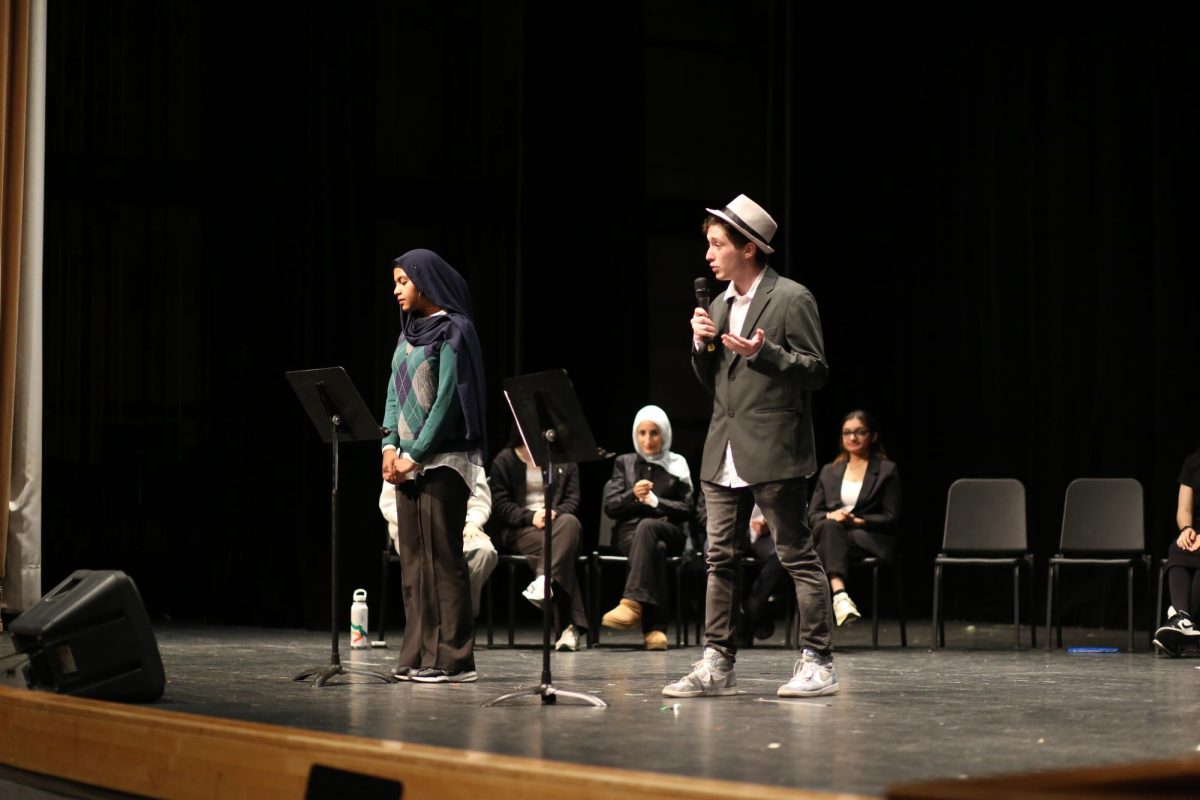 Current junior and SU President Candidate Aki Benjamin debating against current senior Thaseena Anjum for the position of Club Liasion during last school year's SU debate.  
