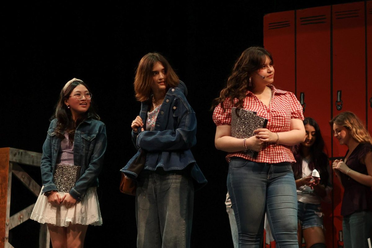 Wendy Jo, Urleen, and Rusty, performed by sophomore Clair Kim, junior Sophia Cherry, and sophomore Lilly Chase respectively, sharing a scene at Bomont High School during the April 18 “Footloose” show.
