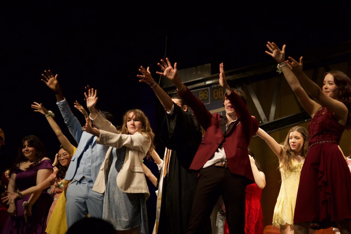 All members of the “Footloose” cast point up to the tech crew, thanking them for their work throughout the production.