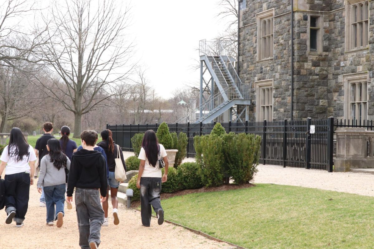 A group of students exploring the Sands Point Preserve near the Hempstead House during the 2026 Reading Initiative Trip.

