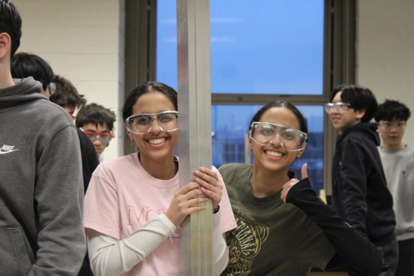 Vidhi and Vaibhvi preparing to cut some metal tubes for the elevator mechanism of the 2024-2025 robot. Both Vidhi and Vaibhvi were Co-Heads of CNC during this build season. 
