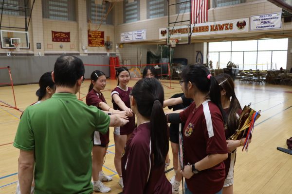The Townsend Harris girls varsity badminton team huddling up before their game against James Madison on May 4.